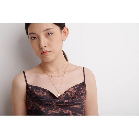 Triple-layer necklace with round pendant, worn – Charmhabit
