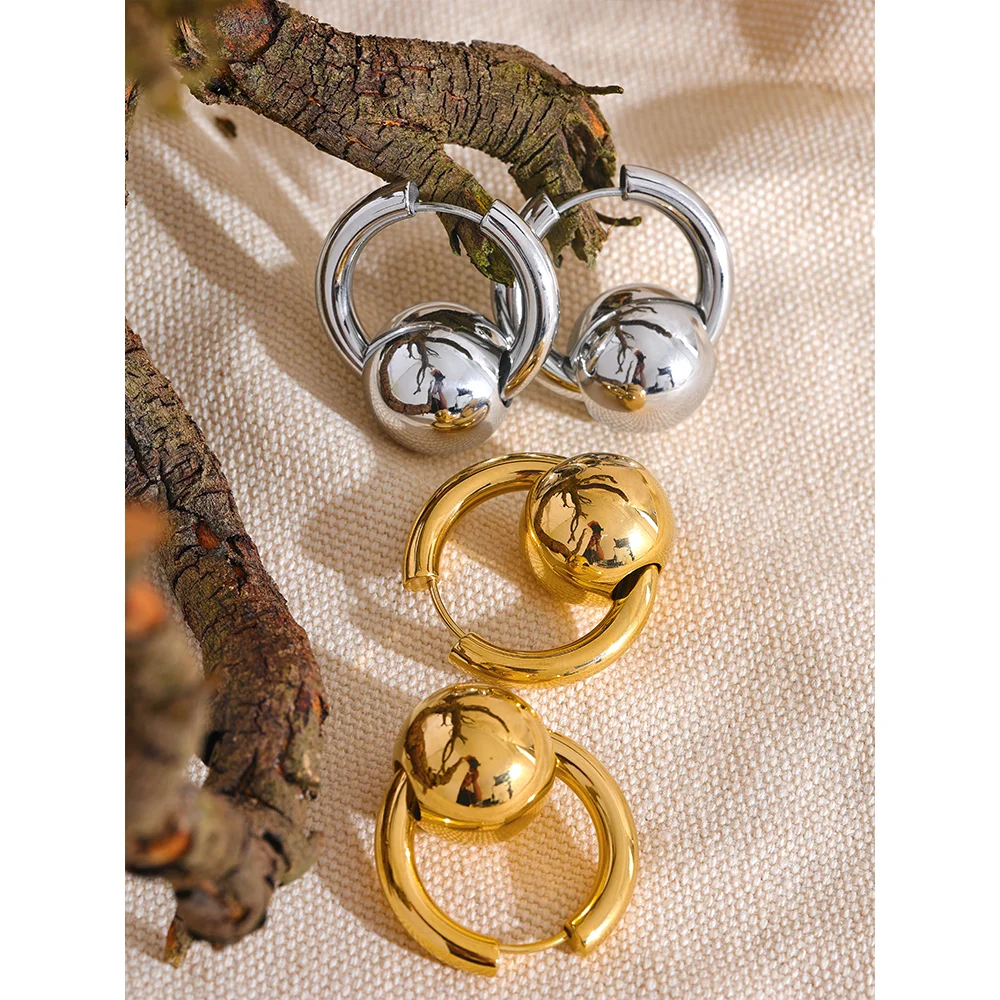 Hoop earrings with a gold or silver tone sphere, gold and silver, styled shot – Charmhabit