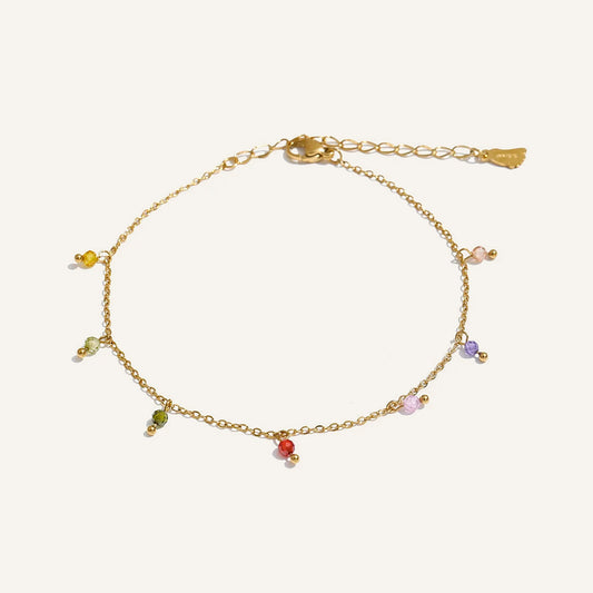 Anklet with colourful beads, gold tone, on a light background – Charmhabit