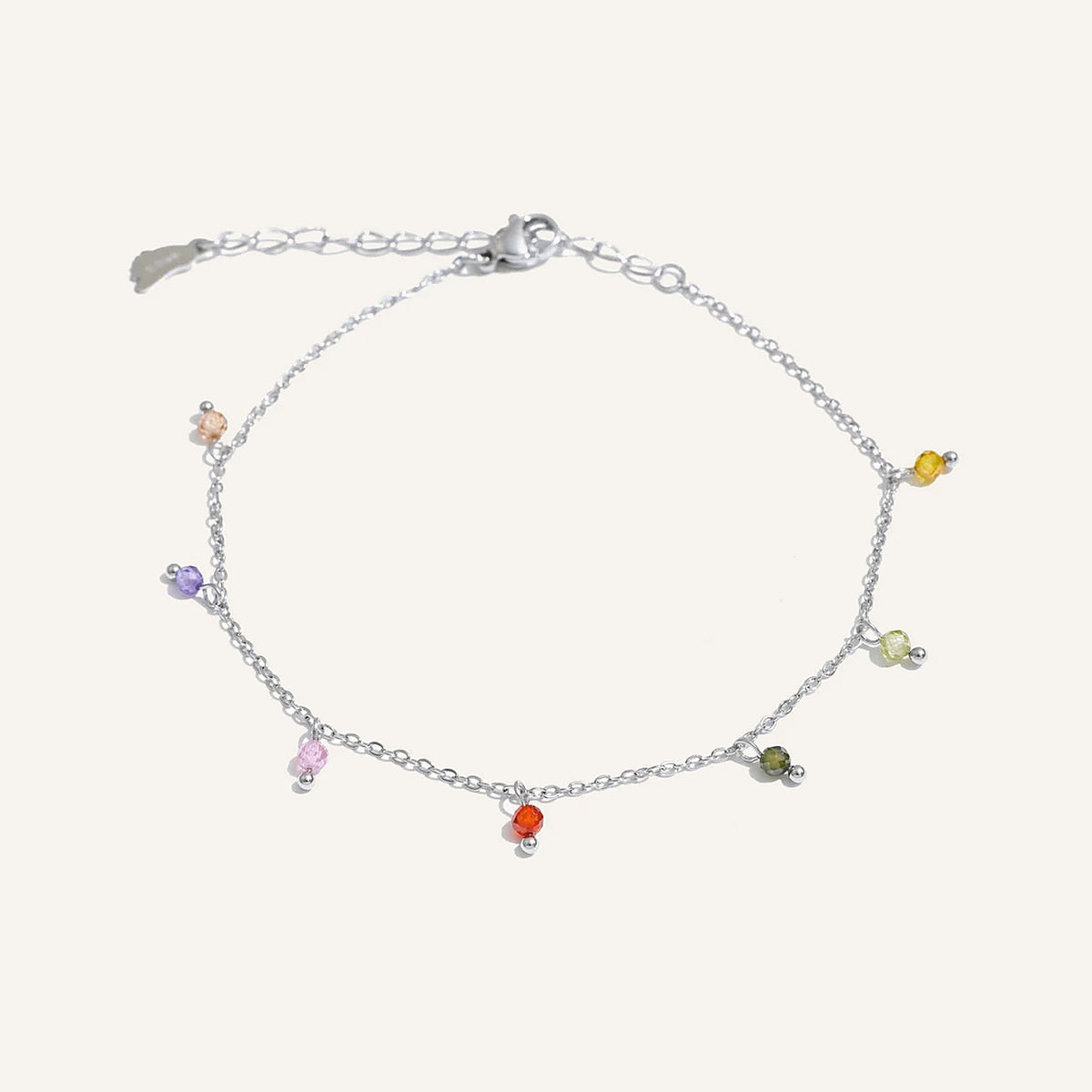 Anklet with colourful beads, silver tone, on a light background – Charmhabit