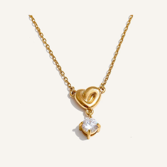 Necklace with a small cubic zirconia heart, gold tone – Charmhabit