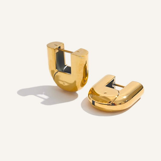 Sturdy U-shaped hoop earrings, gold tone, on a light background – Charmhabit