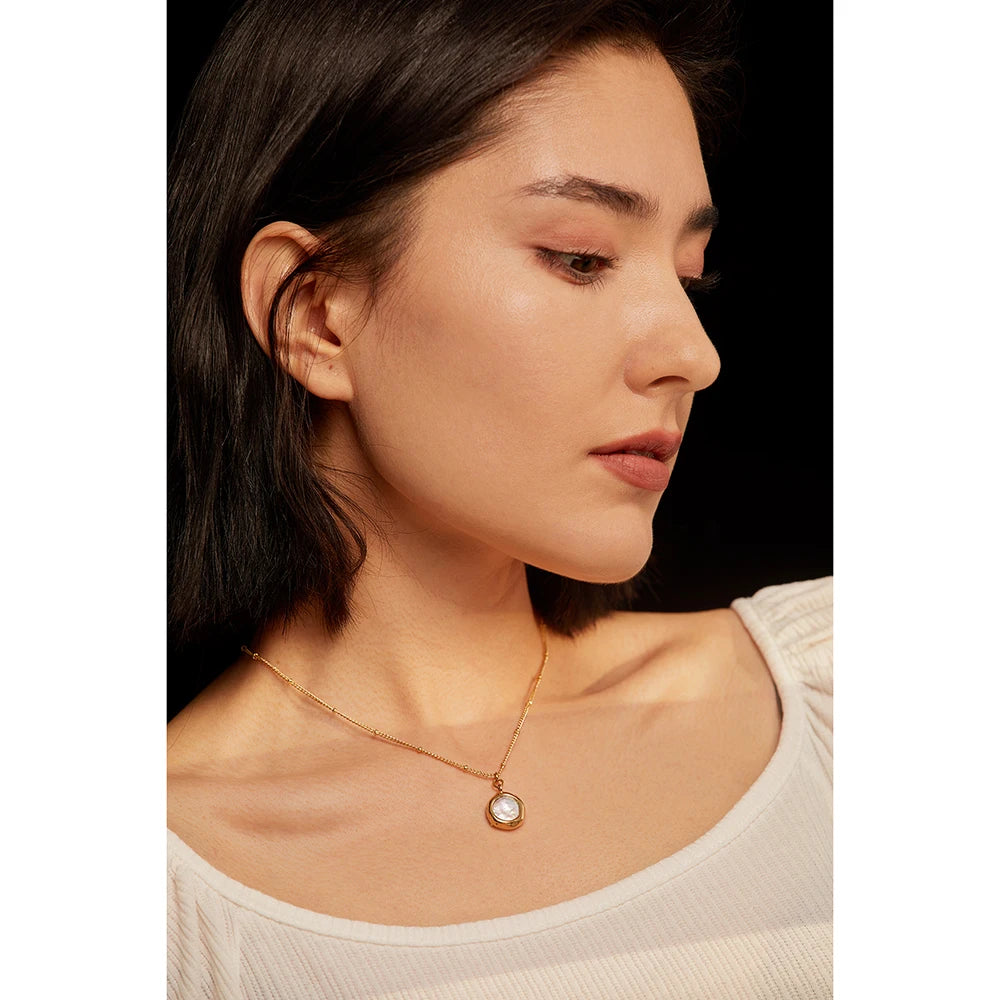 Necklace with pearl and cubic zirconia pendant, worn – Charmhabit