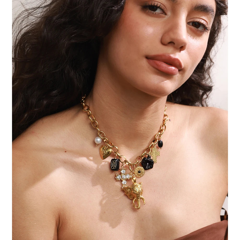 Charm necklace with heart, flower and cross, worn – Charmhabit