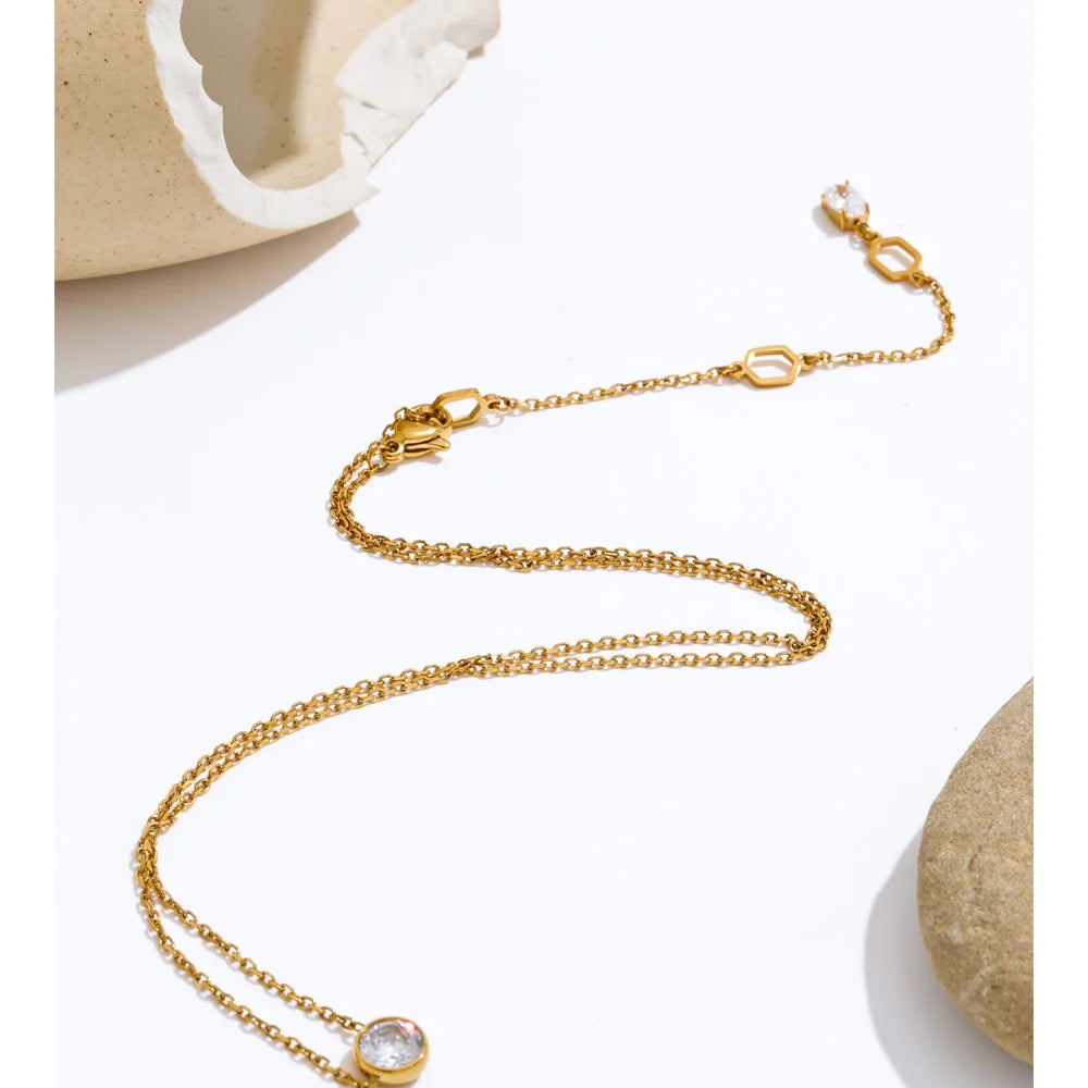 Fine necklace with round cubic zirconia pendant, styled shot – Charmhabit