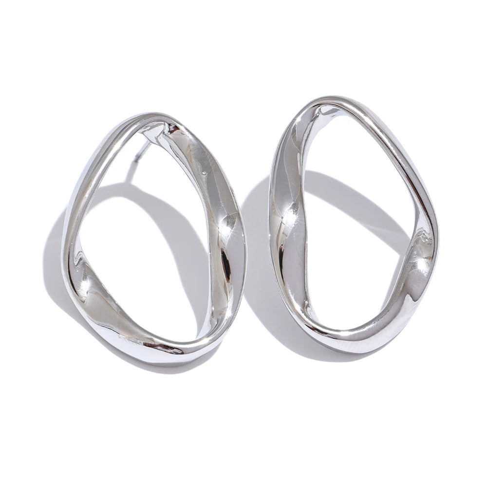 Oval open stud earrings, silver tone, on a light background – Charmhabit