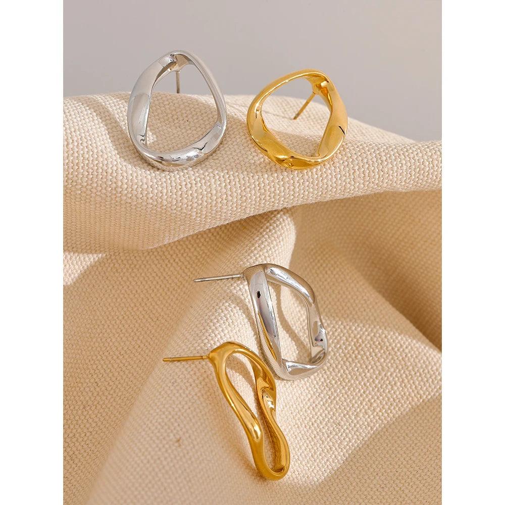 Oval open stud earrings, gold tone and silver tone, styled shot – Charmhabit