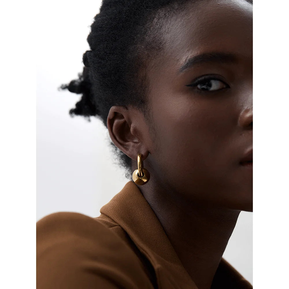 Hoop earrings with a gold or silver tone sphere, gold, worn – Charmhabit
