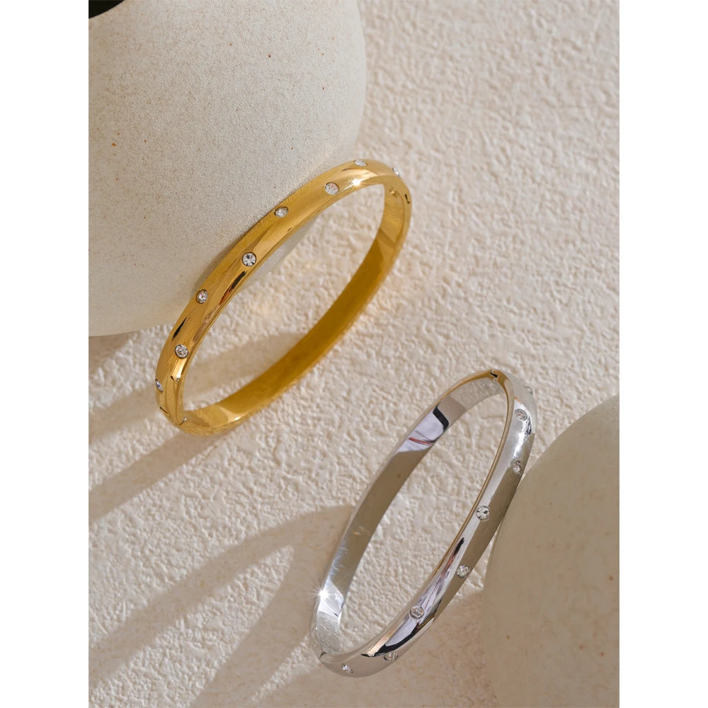 Bangle bracelet with zirconia, gold and silver tone, on stone – Charmhabit