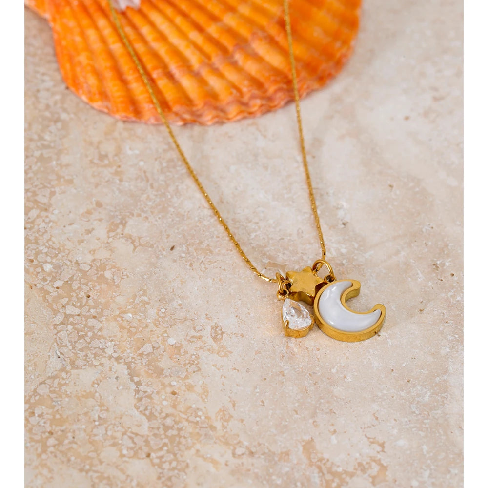 Necklace with shell, moon and star pendant, styled shot – Charmhabit