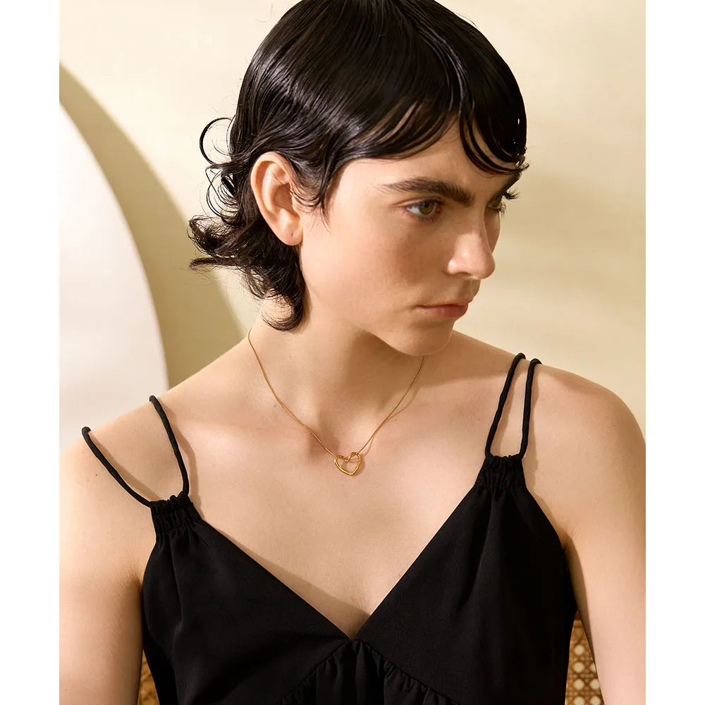 Necklace with open heart, worn, side view – Charmhabit