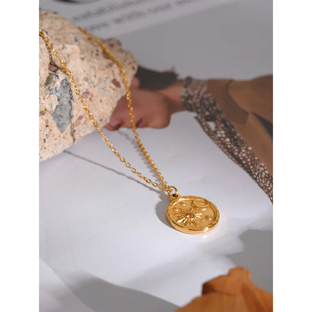 Styled shot of a sun and moon medallion necklace – Charmhabit