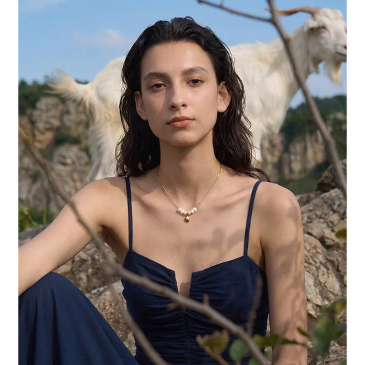 Pearl necklace with star pendant worn – Charmhabit