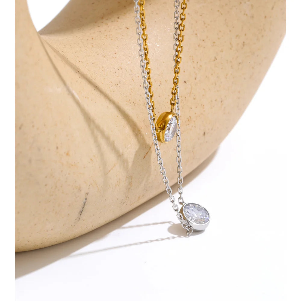 Fine necklace with round cubic zirconia pendant, styled shot – Charmhabit