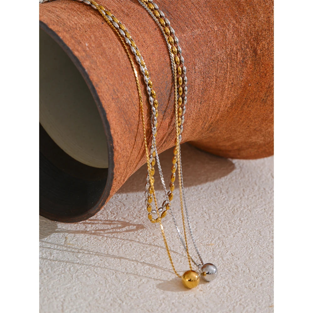 Collier double avec pendentif boule, doré et argenté, sur céramique – Charmhabit