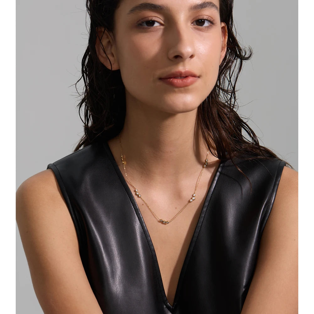 Delicate necklace with cubic zirconia stones, worn – Charmhabit
