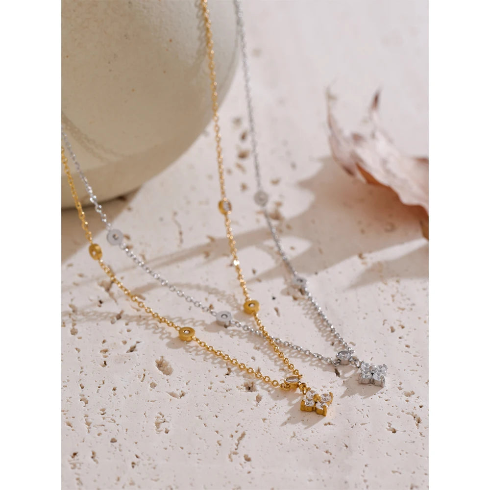 Necklace with cubic zirconia flower pendant, gold and silver tones, styled shot on stone – Charmhabit