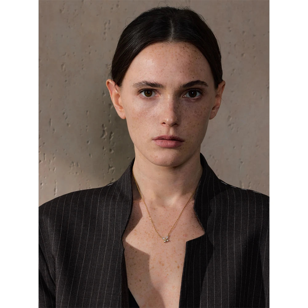 Butterfly necklace with cubic zirconia in a gold tone, worn – Charmhabit