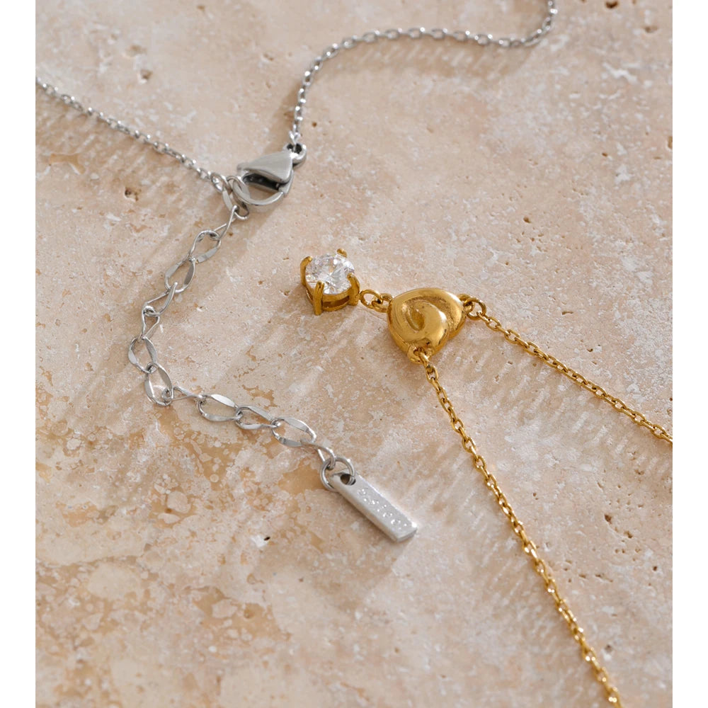 Necklace with a small cubic zirconia heart styled shot – Charmhabit