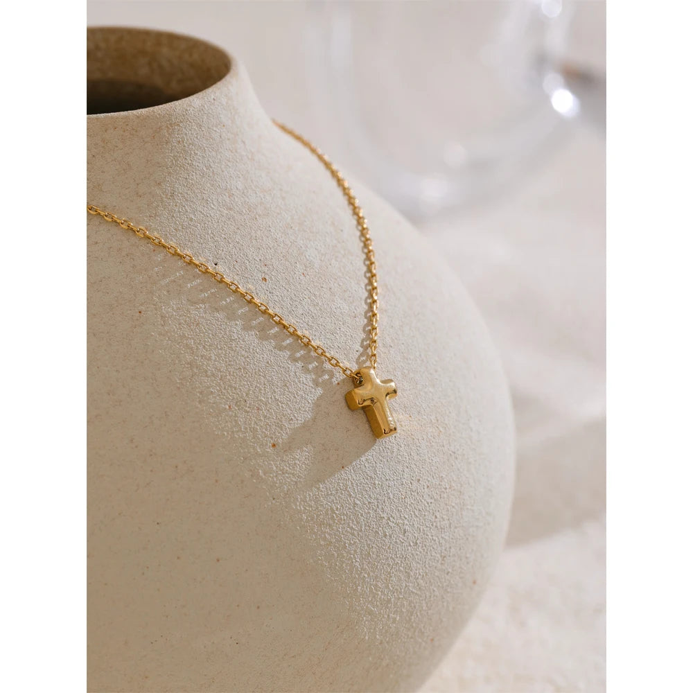 Necklace with a small cross pendant styled shot – Charmhabit