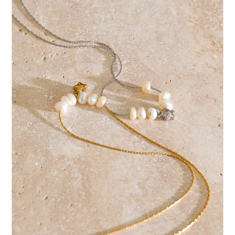 Styled shot of a pearl necklace with star pendant – Charmhabit