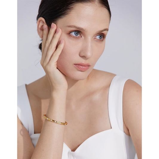 Bangle with a row of cubic zirconia, worn – Charmhabit
