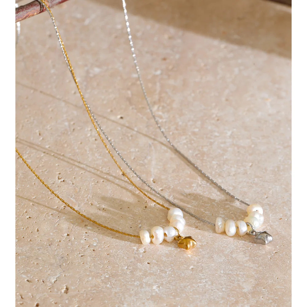 Styled shot of a pearl necklace with star pendant – Charmhabit