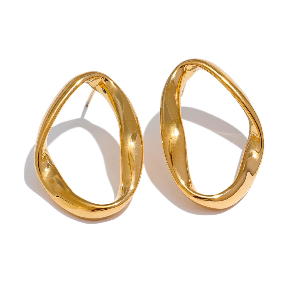 Oval open stud earrings, gold tone, on a light background – Charmhabit