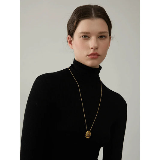 Long necklace with smooth oval pendant worn – Charmhabit