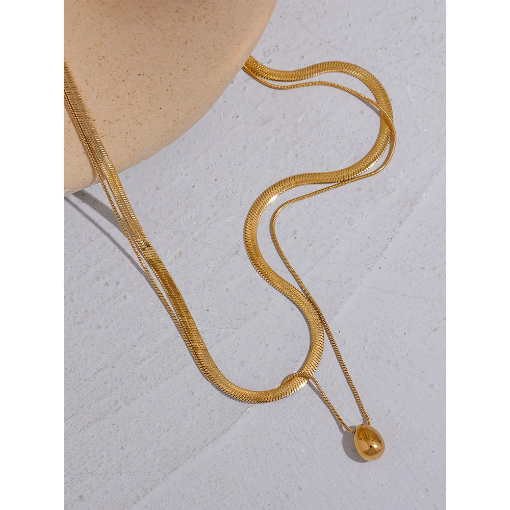 Double-layer necklace with a drop pendant, gold tone, styled shot – Charmhabit