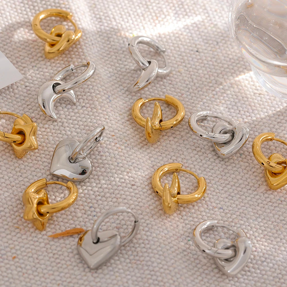 Huggie hoops with heart, star or moon charms in gold and silver, styled shot – Charmhabit