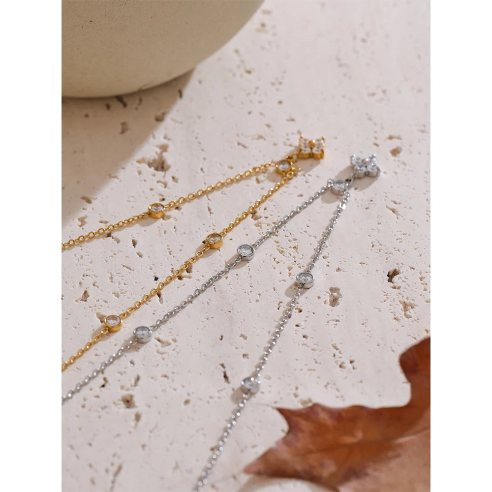 Necklace with cubic zirconia flower pendant, gold and silver tones, on stone with a leaf – Charmhabit