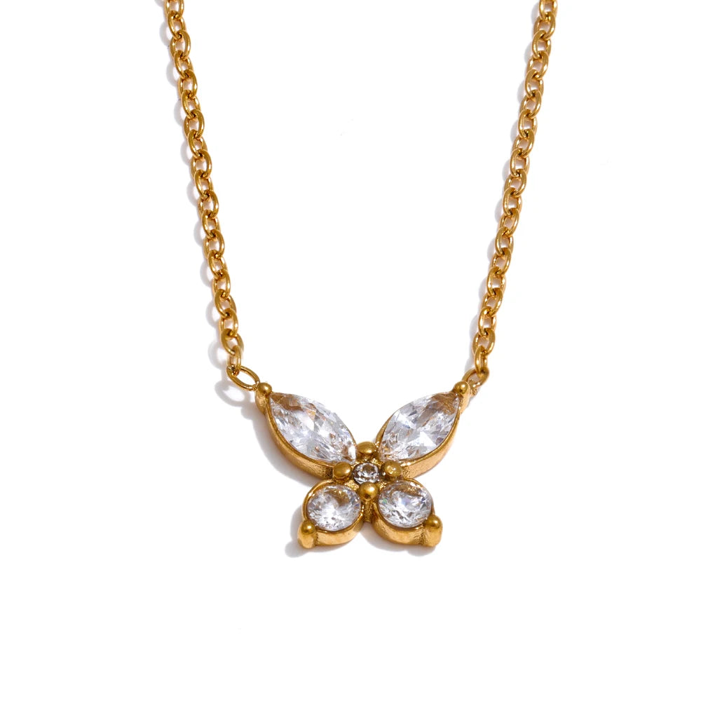 Butterfly necklace with cubic zirconia in a gold tone, on a light background – Charmhabit