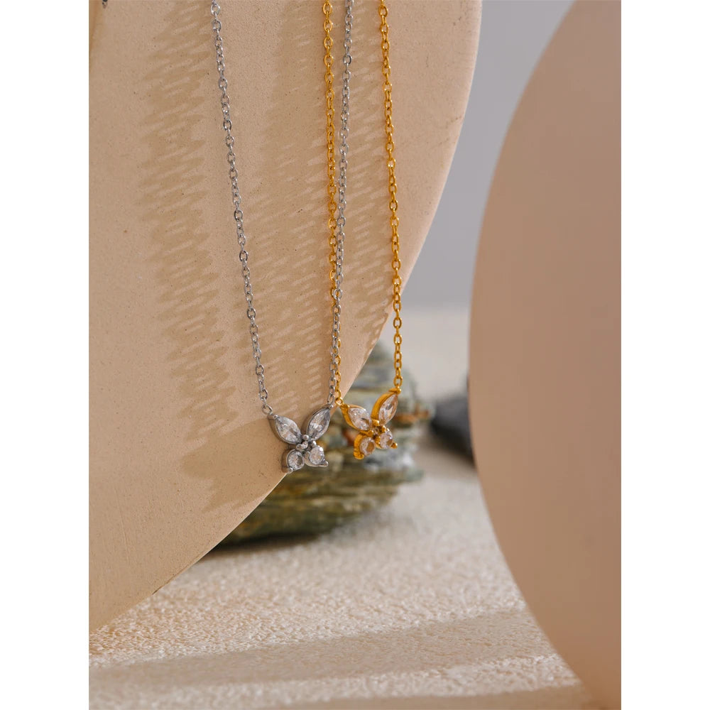 Butterfly necklace with cubic zirconia in gold and silver tones, styled shot – Charmhabit