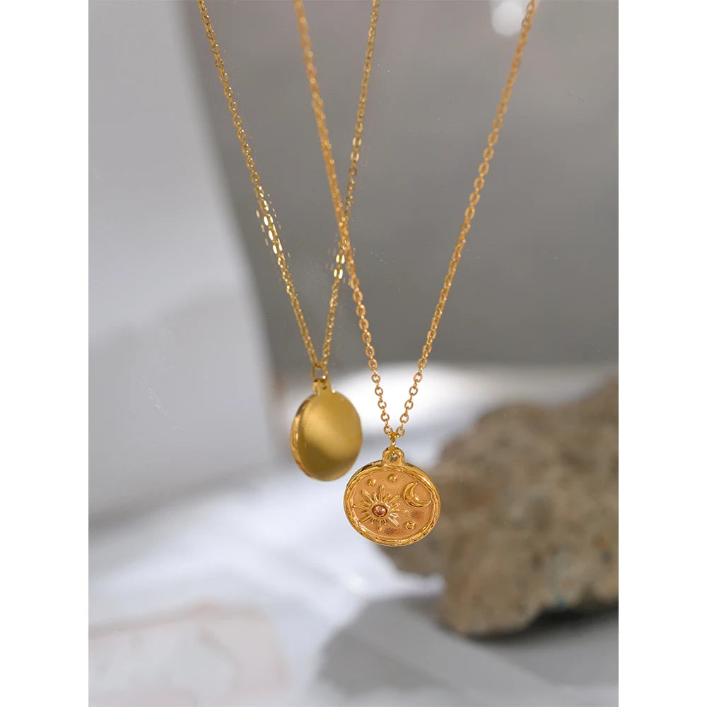 Styled shot of a sun and moon medallion necklace – Charmhabit