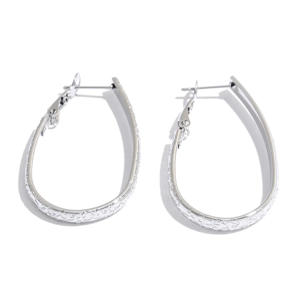 Ovale creolen met structuur, zilver – Charmhabit