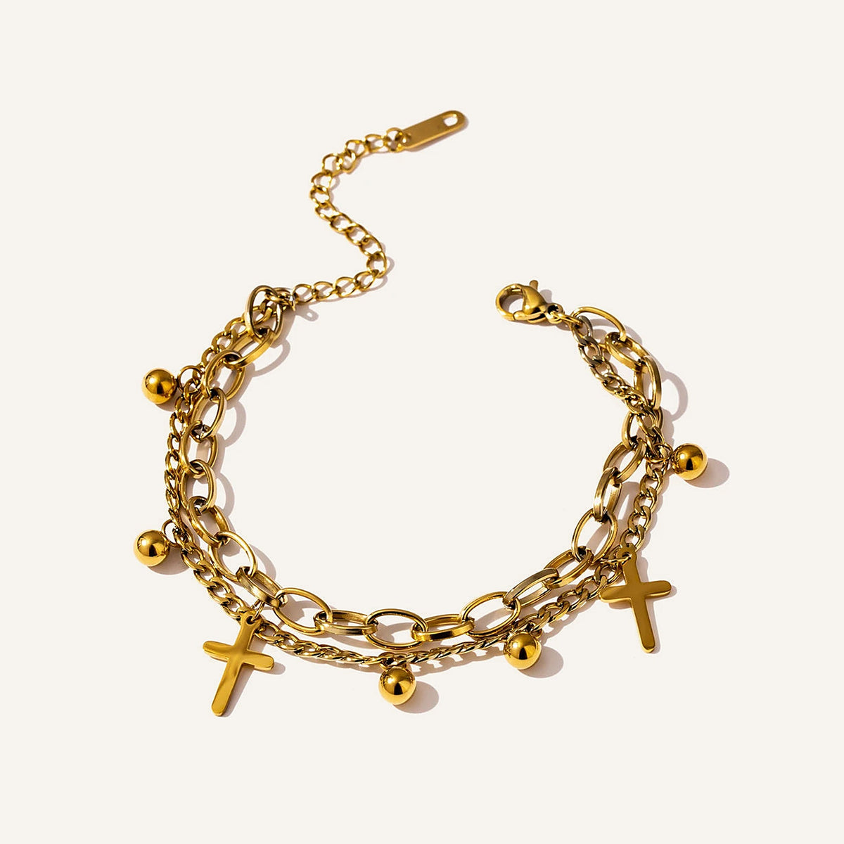 Doppellagiges Kreuzarmband, goldfarben – Charmhabit