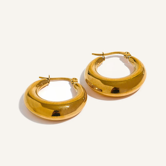 Domed hoop earrings with a high-gloss finish, gold tone, on a light background – Charmhabit