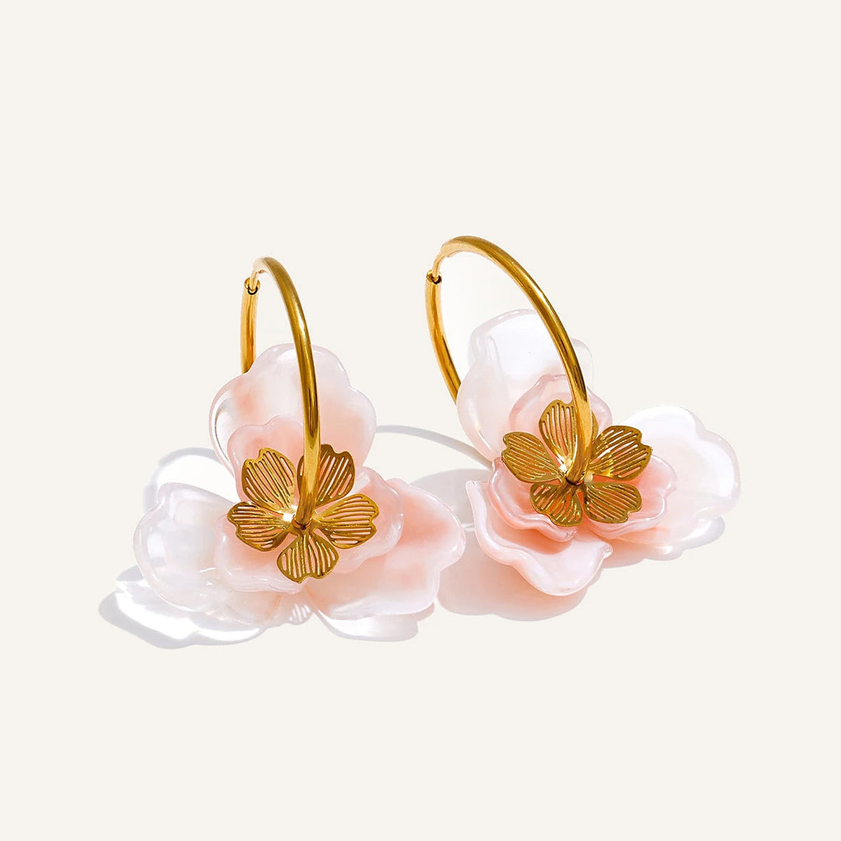 Resin flower hoop earrings with a pink flower on a light background – Charmhabit