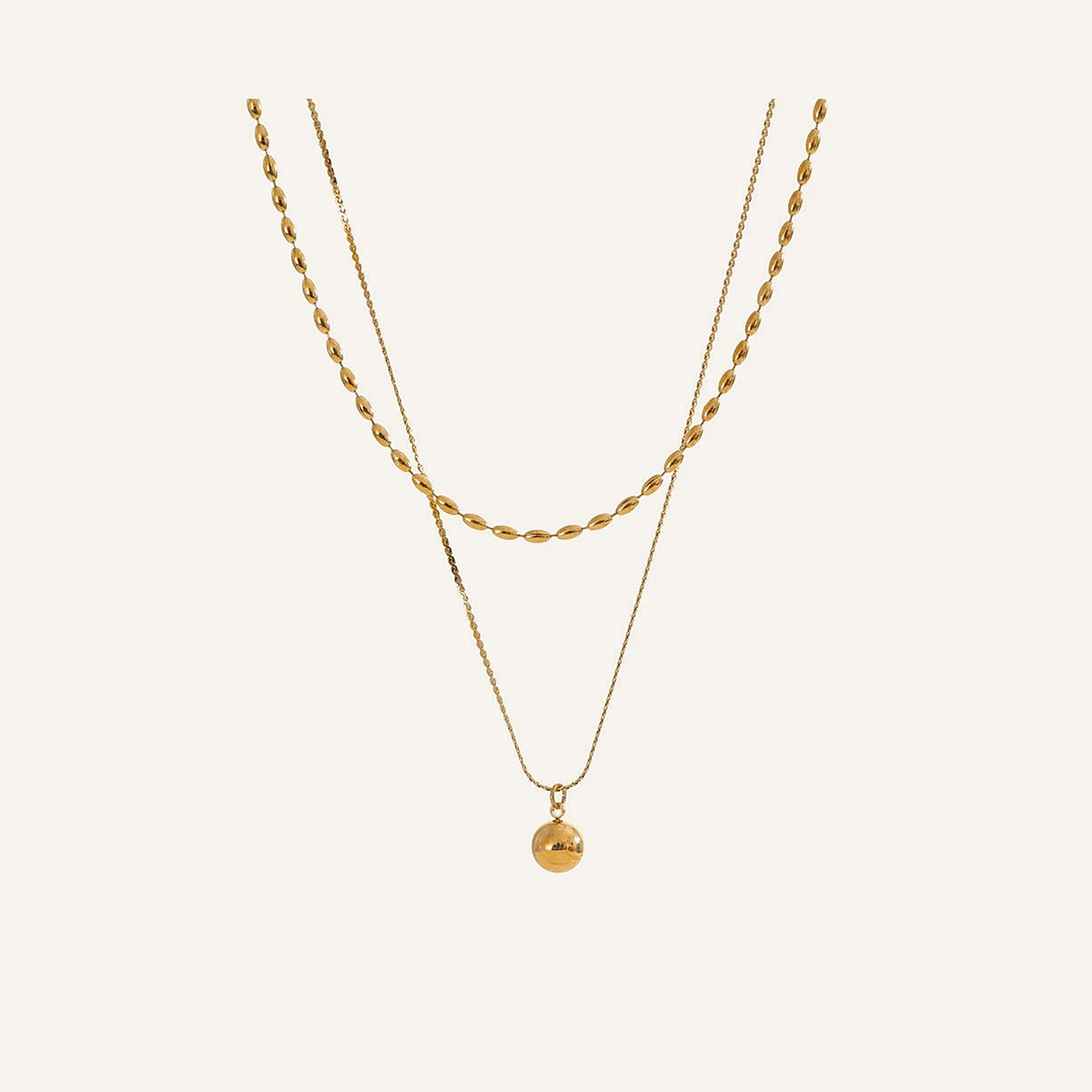 Collier double avec pendentif boule, doré, sur fond clair – Charmhabit