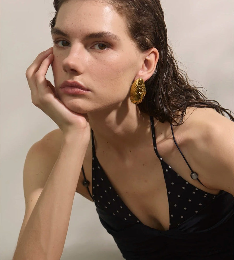 Large ribbed shell-shaped stud earrings, worn – Charmhabit