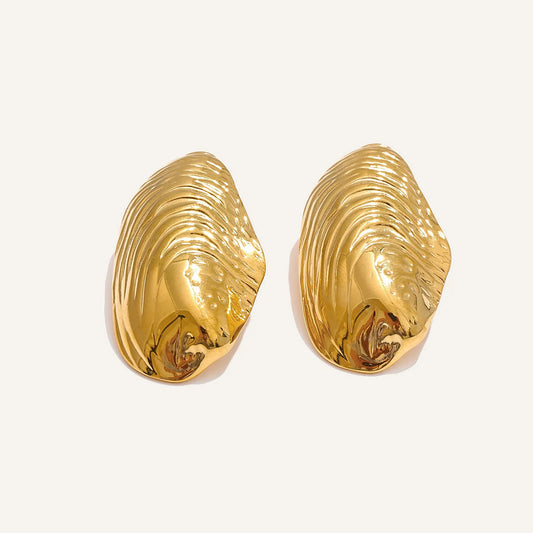 Large ribbed shell-shaped stud earrings, gold tone, on a light background – Charmhabit