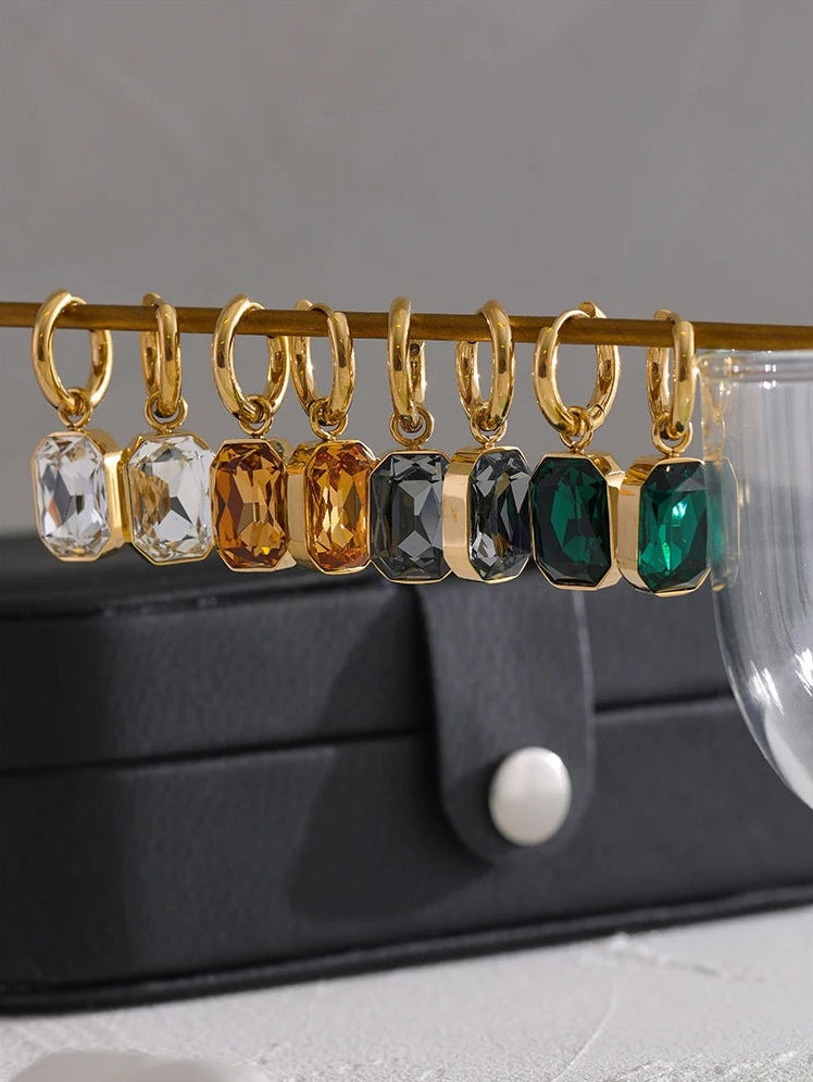 Huggie hoops with an octagonal crystal pendant in all colours, hanging – Charmhabit