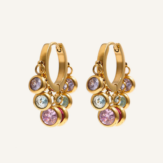 Huggie hoops with colourful cubic zirconia charms, gold tone, on a light background – Charmhabit