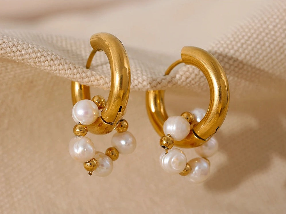 Huggie hoops with pearls, gold tone, on linen – Charmhabit