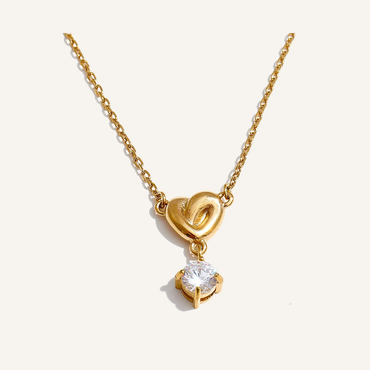 Necklace with a small cubic zirconia heart, gold tone – Charmhabit