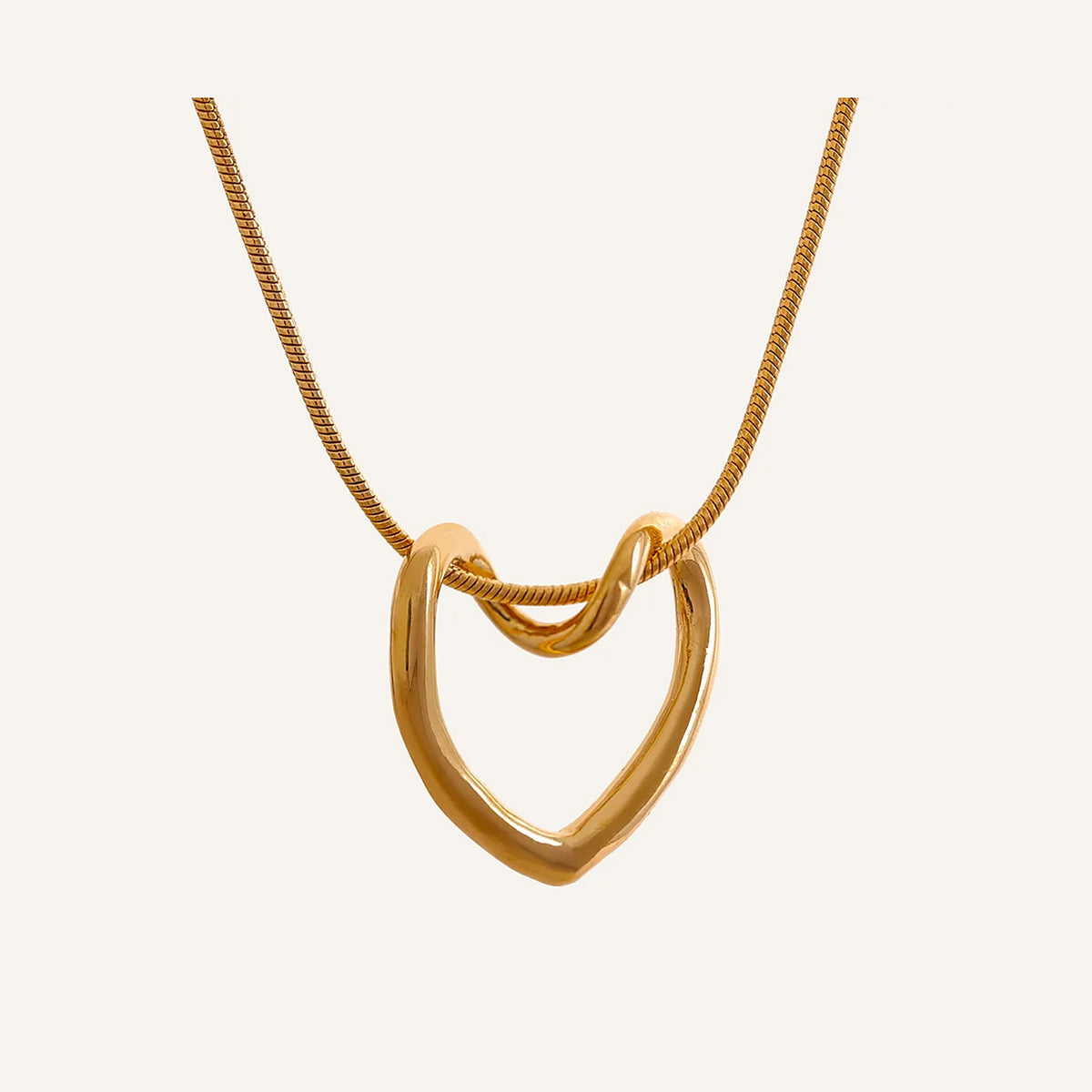 Necklace with open heart, gold tone, on a light background – Charmhabit