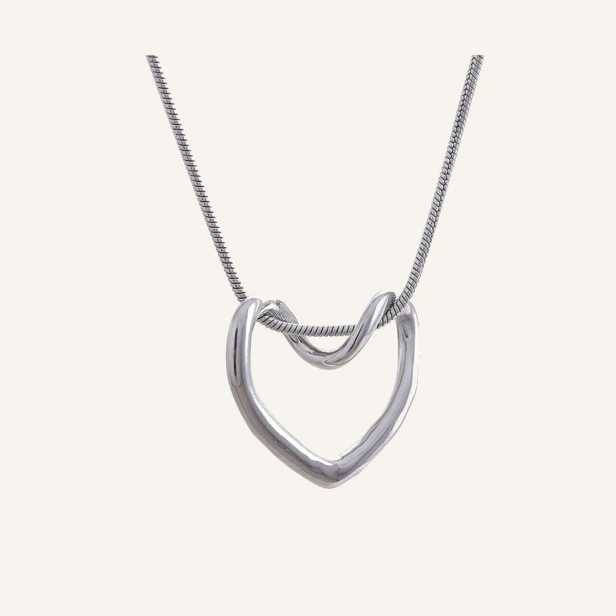 Necklace with open heart, silver tone, on a light background – Charmhabit