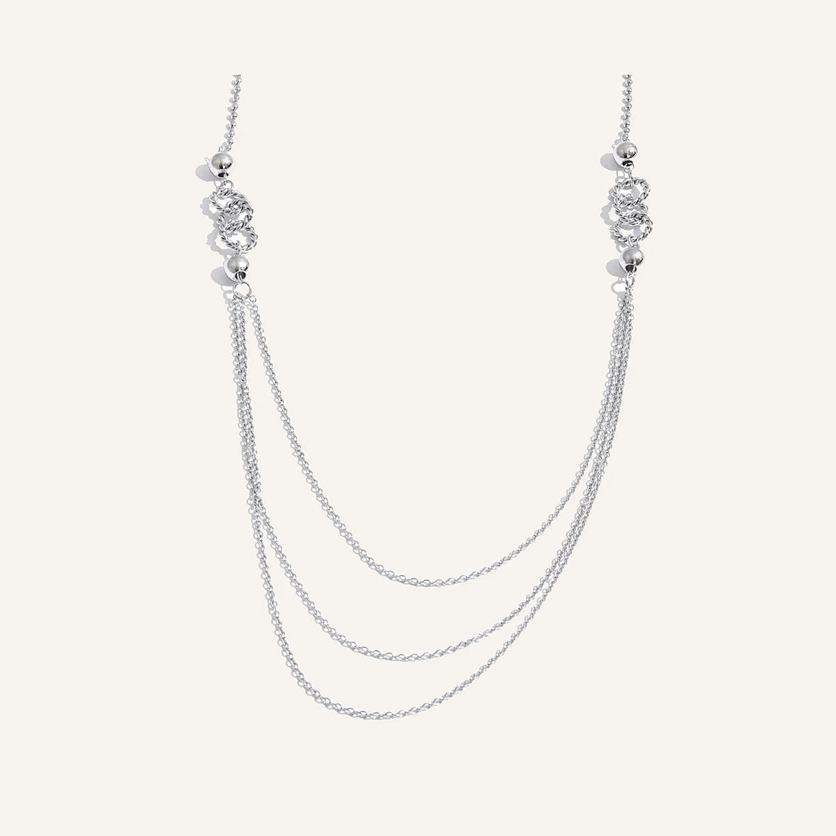 Long layered necklace, silver tone, on a light background – Charmhabit