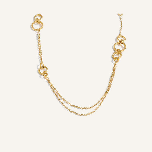 Long necklace for over the chest, gold tone, on a light background – Charmhabit